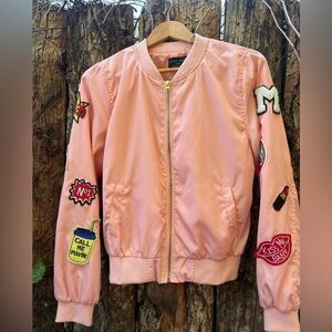 Light pink bomber jacket with patches